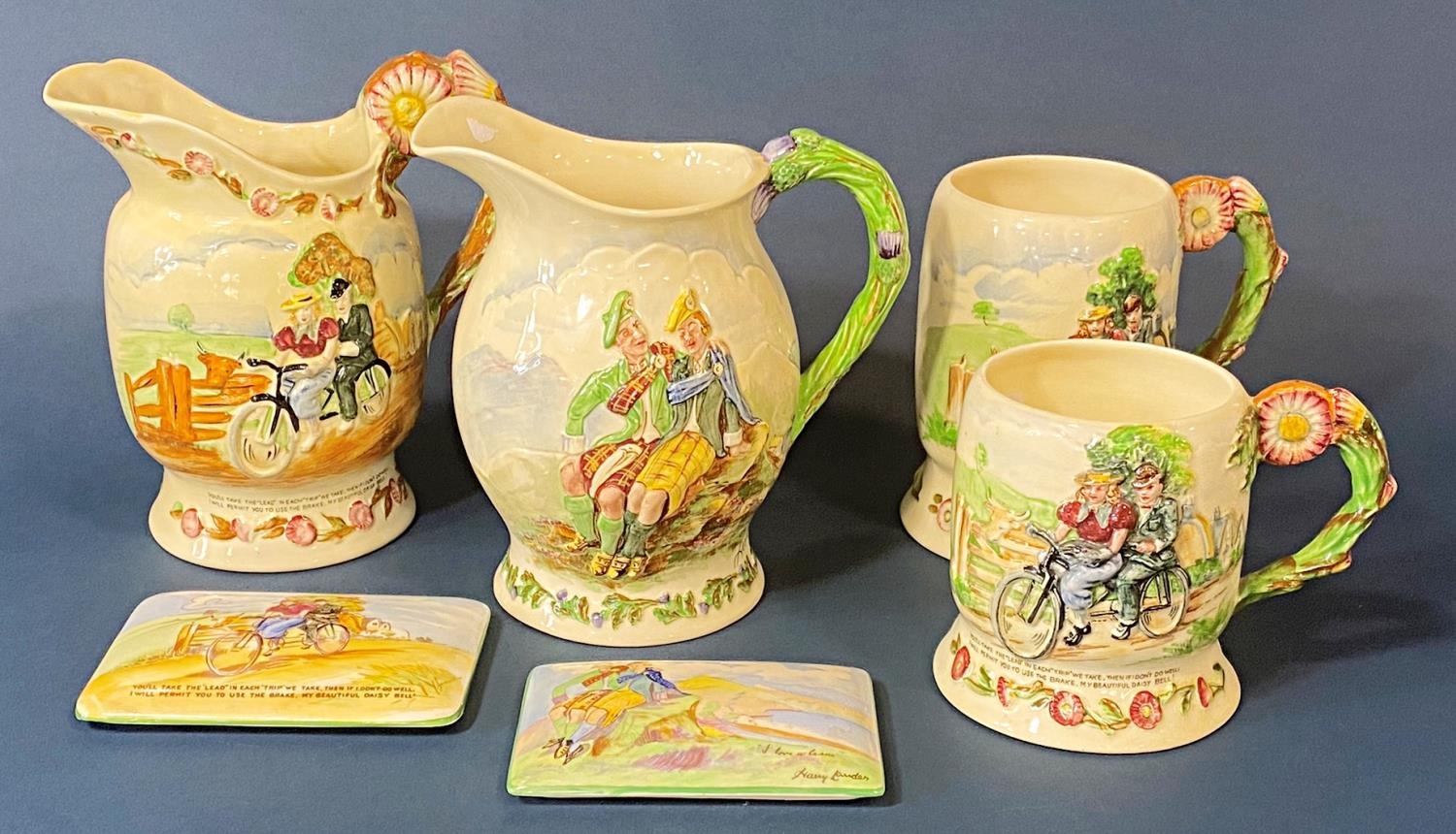 A collection of Crown Devon ware comprising two jugs with relief moulded detail, Daisy Bell,