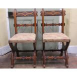Pair of Victorian pegged oak side chairs with X shaped supports, with carved cresting rail and