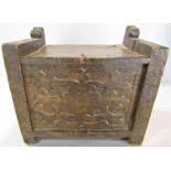 A 19th century rustic storage box with a hinged lid and carved floral front panel, 35.5cm w x 32cm h