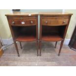 A pair of inlaid Edwardian mahogany bedside or lamp tables of bow fronted outline with frieze drawer