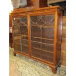 19th century mahogany cabinet enclosed by a pair of astragal glazed doors on bracket support,