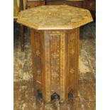 Moroccan occasional table, the octagonal top raised on a further octagonal base, with geometric