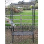 A contemporary painted light steel framed garden arbour and combined strap work bench seat and