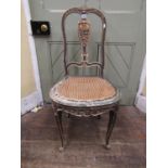 Single 19th century side chair with cane panelled seat, the shaped back with vase shaped splat and