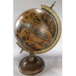 A world globe in the antique classical style on a stand, 60cm high approx (as found)