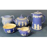 A collection of Wedgwood pale blue ground jasperware in the classical style, comprising teapot and