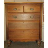 A stripped and waxed satin walnut chest of three long and two short drawers raised on turned