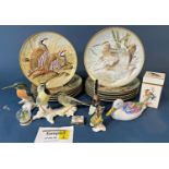 A collection of Coalport bisque, Boehm, German and other models of wild birds including Bee-eater,