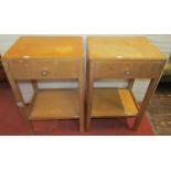 Pair of pale oak bedside tables, each enclosing a single drawer over an open shelf, on rounded