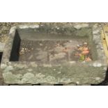 A weathered natural stone trough of rectangular form 66 cm long x 47 cm wide x 18 cm high (af