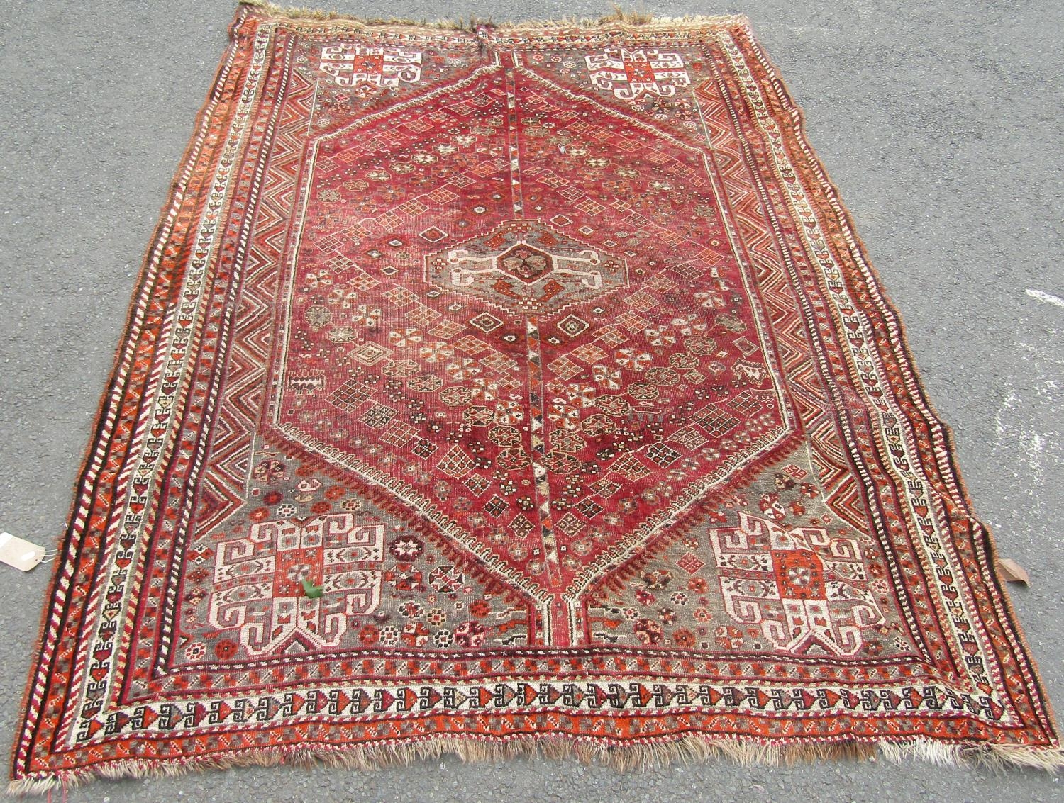 A slightly worn old Persian carpet, 280cm x 200cm