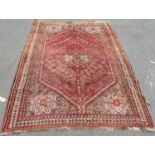 A slightly worn old Persian carpet, 280cm x 200cm