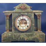 A Victorian onyx mantle clock of classical style enclosing an eight day striking movement