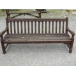 A vintage substantial stained hardwood garden bench with slatted seat and back, 180 cm long together