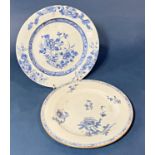 Two Chinese blue and white porcelain dishes, (Qing period), with floral decoration, diameter approx.