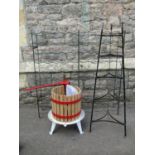 A small fruit press, wooden slatted and steel banded together with a vintage floorstanding five tier
