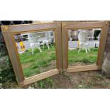 A pair of gilt framed mirrors with reeded borders and roundle corners including bevelled edge mirror