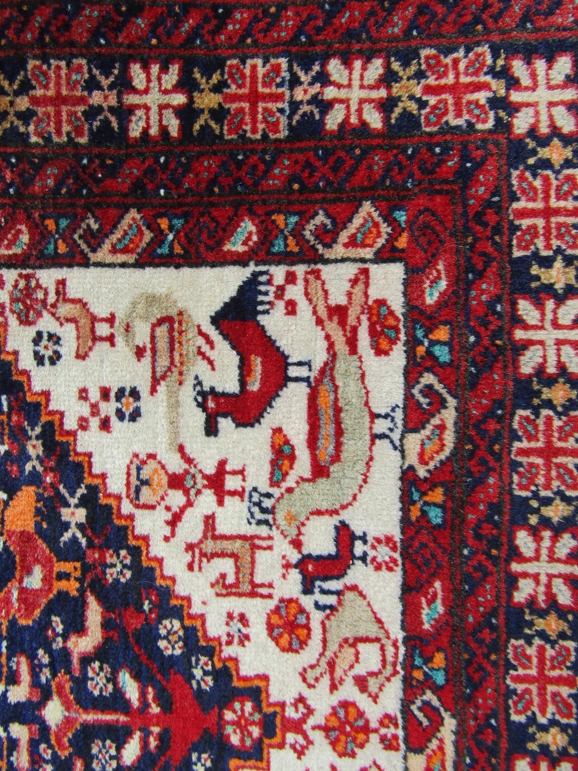 A mid 20th century Beloudj rug with a geometric central diamond shaped medallion with stylised - Image 2 of 3