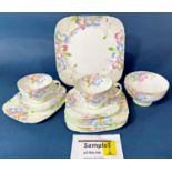 A Paragon Clematis pattern tea service for ten with floral detail in pastel shades