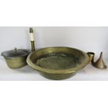 A collection of metal ware, including a brass basin, a copper funnel, a converted brass candlestick,