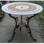 A painted cast aluminium garden terrace table with decorative circular pierced top raised on swept