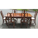 An Edwardian mahogany dining room suite comprising an extending dining table on four cariole