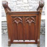 A Victorian ecclesiastical lectern in pitched and oak with gothic revival carved finish,