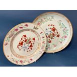 Two Chinese famille rose porcelain dishes with floral and gilt decoration, bearing central family