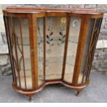 1950s walnut veneered china display cabinet with double bow outline with etched panels raised on