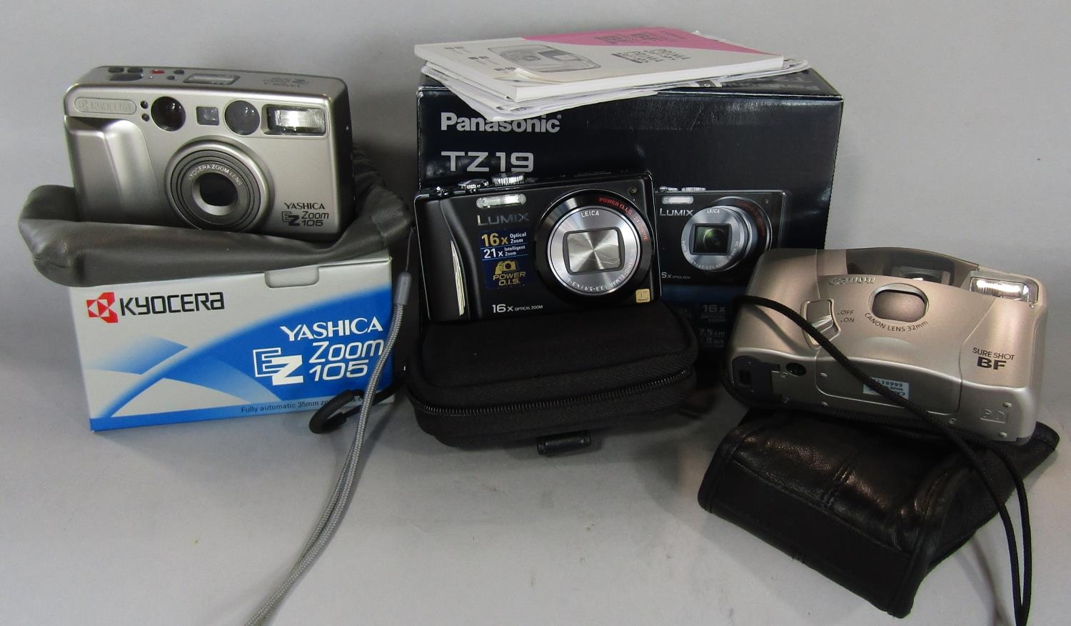 A digital compact Panasonic TZ19 14.1mp outfit, boxed Yasmica EZ zoom 105 and Canon Supershot film