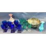 Six blue wine glasses on square feet, six pale green wine glasses with clear stems, a red and