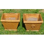 A pair of treacle glazed garden planters in the form of wicker baskets of square tapered form, 35 cm