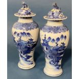 Pair of Chinese blue and white porcelain baluster vases with lion finial covers (Qing period) height