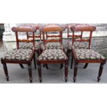 A set of six 19th century mahogany dining chairs with shaped and scrolled bar backs over drop in
