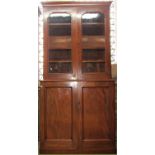 A Victorian mahogany library bookcase, the lower section enclosed by a pair of panelled doors