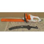 A Stihl electric hedge trimmer model HSE42 together with a Castelgarden XC 19 PE electric chainsaw