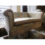 A suite of traditional lounge furnishings comprising a pair of two seat sofas, together with a three