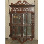 Late 19th century mahogany set of wall shelves on three tiers with turned spindle mouldings, pierced