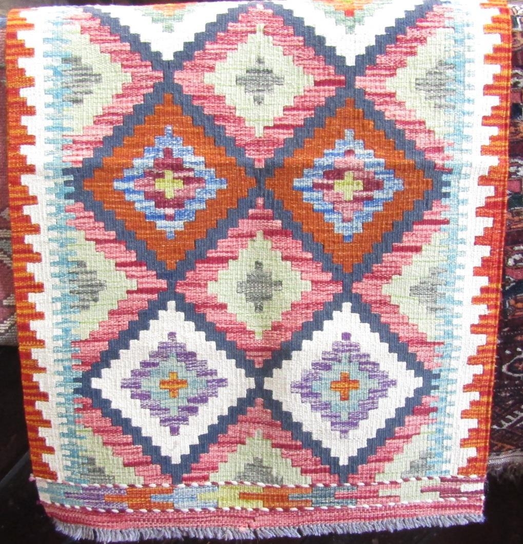 A Chobi kilim runner with stepped diamond lozenges 195cm x 64cm.