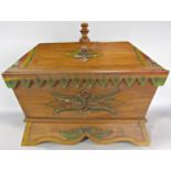 A sarcophagus shaped box with removable lid and side carrying handles, 51cm wide x 43cm high.