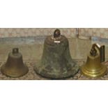 A 19th century bronze turret bell 20 cm diameter and two other smaller bells