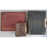 Two late 19th/early 20th century photograph albums containing family portraits and both with metal