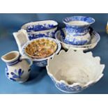 A collection of contemporary blue and white printed ware including foot bowl, two handled ewer,