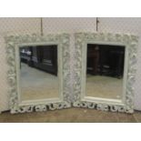 A pair of rectangular wall mirrors with acanthus scroll frames with painted finish, 78cm x 60cm