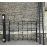 A Victorian style 4ft 6 double bedstead with light tubular frame complete with side rails and