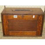 A vintage oak portable engineers tool cabinet enclosed by a removable rectangular panelled door