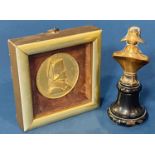 A framed medallion commemorating Napoleon and a further small brass bust of Napoleon on a turned