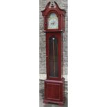 A contemporary three train longcase clock, with broken arch brass dial, glazed case and