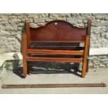 An Edwardian mahogany four foot bedstead with carved and moulded detail, together with a further