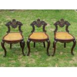 Set of three 19th century Indo-Portuguese side chairs with well carved detail, shaped and pierced